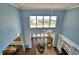 Bright, airy living room boasts a high ceiling and backyard view at 329 Hamilton Shores Ne Dr, Winter Haven, FL 33881