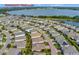 Aerial view showcasing the home's location within the community, near a lake and the community clubhouse at 3710 Plymouth Dr, Winter Haven, FL 33884