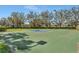 Outdoor basketball court surrounded by mature trees, providing a recreational space for residents at 3710 Plymouth Dr, Winter Haven, FL 33884