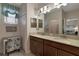 Bathroom features a dual sink vanity, neutral color palette, and plenty of storage space at 3710 Plymouth Dr, Winter Haven, FL 33884