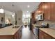 Bright kitchen features stainless appliances, tile backsplash, light countertops, and wood cabinets at 3710 Plymouth Dr, Winter Haven, FL 33884