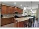 Modern kitchen featuring tile backsplash, stainless steel appliances, and a breakfast bar at 3710 Plymouth Dr, Winter Haven, FL 33884