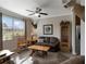 Comfortable living room with a ceiling fan, hardwood floors, and plenty of natural light at 3710 Plymouth Dr, Winter Haven, FL 33884