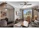 Cozy living room features hardwood floors, a ceiling fan, and comfortable seating at 3710 Plymouth Dr, Winter Haven, FL 33884