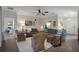 Spacious living room featuring neutral tones, ceiling fan, and decorative furniture at 3710 Plymouth Dr, Winter Haven, FL 33884