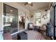 Relaxing screened lanai with comfortable furniture and views into the home's kitchen and living room at 3710 Plymouth Dr, Winter Haven, FL 33884