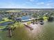 Stunning aerial view of community clubhouse with pool, lake, and lush landscaping at 3912 Baldwin Ln, Winter Haven, FL 33884