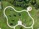 Aerial view of community park with winding walking trails and covered gazebo at 3912 Baldwin Ln, Winter Haven, FL 33884