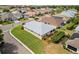 Aerial view of a suburban home with a well-manicured lawn, shingle roof, and surrounding neighborhood at 3912 Baldwin Ln, Winter Haven, FL 33884