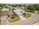 Aerial view of a home in a well-maintained community with lush green lawns and mature landscaping at 3912 Baldwin Ln, Winter Haven, FL 33884