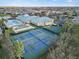 Aerial view of a beautiful community with tennis and basketball courts, pool, and club house at 3912 Baldwin Ln, Winter Haven, FL 33884