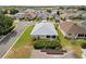 Aerial view of a residential neighborhood with beautiful landscaping and a well-maintained roof at 3912 Baldwin Ln, Winter Haven, FL 33884