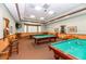 Billiard room featuring multiple pool tables, comfortable seating, and a relaxing atmosphere at 3912 Baldwin Ln, Winter Haven, FL 33884