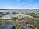 Aerial view of the waterfront clubhouse, surrounded by manicured landscaping and parking at 3912 Baldwin Ln, Winter Haven, FL 33884