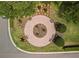 Aerial view of a circular seating area within the community, surrounded by manicured lawns at 3912 Baldwin Ln, Winter Haven, FL 33884