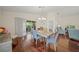 Dining area with wood floors, sliding glass doors, and comfortable seating at 3912 Baldwin Ln, Winter Haven, FL 33884