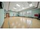 Spacious fitness room with ample natural light, blue chairs, and plenty of room for activities at 3912 Baldwin Ln, Winter Haven, FL 33884