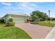 Well maintained single-story home with an attached garage and brick paver driveway at 3912 Baldwin Ln, Winter Haven, FL 33884