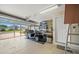 Spacious garage equipped with a golf cart, ample storage, and an automatic door opener at 3912 Baldwin Ln, Winter Haven, FL 33884