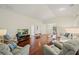 Bright living room with hardwood flooring, comfortable seating, and a view of the front door at 3912 Baldwin Ln, Winter Haven, FL 33884