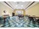 Meeting room with tables and chairs and checkered floor, providing a versatile space for gatherings at 3912 Baldwin Ln, Winter Haven, FL 33884
