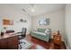 Bright office space with hardwood floors, a sofa, a desk, and a ceiling fan, ideal for remote work at 3912 Baldwin Ln, Winter Haven, FL 33884