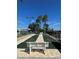 Outdoor shuffleboard courts with well-maintained surfaces, seating, and a lovely surrounding landscape at 3912 Baldwin Ln, Winter Haven, FL 33884