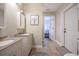 Bathroom featuring double sinks and tile floors at 4010 Paw Paw Trl, Lake Wales, FL 33898