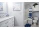 Fresh bathroom with a modern vanity, marble countertops, and a shower-tub combination with stylish curtain at 4010 Paw Paw Trl, Lake Wales, FL 33898
