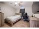 A cozy bedroom with wood floors, desk setup, and large TV creating an inviting space at 4010 Paw Paw Trl, Lake Wales, FL 33898