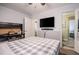 Bedroom with ceiling fan, hardwood floors, a desk and a queen sized bed at 4010 Paw Paw Trl, Lake Wales, FL 33898