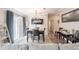 Inviting dining area with sliding glass door, modern chandelier, and lots of space perfect for everyday meals and celebrations at 4010 Paw Paw Trl, Lake Wales, FL 33898