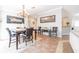 The dining room features an elegant chandelier and is a warm space for Gathering gatherings and friendly meals at 4010 Paw Paw Trl, Lake Wales, FL 33898