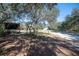 Scenic exterior view featuring a boat, shed, and verdant surroundings at 4010 Paw Paw Trl, Lake Wales, FL 33898