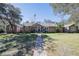 Charming single-story home with inviting brick path and well-manicured lawn on a sunny day at 4010 Paw Paw Trl, Lake Wales, FL 33898