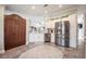 View of kitchen with stainless steel refrigerator and decorative vines on top of the cabinets at 4010 Paw Paw Trl, Lake Wales, FL 33898