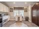 Spacious kitchen area featuring tile flooring, white cabinets, and natural light at 4010 Paw Paw Trl, Lake Wales, FL 33898