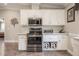 Updated kitchen featuring white cabinets, granite countertops, and stainless steel appliances at 4010 Paw Paw Trl, Lake Wales, FL 33898