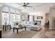 Open-concept living room with vaulted ceilings, big windows and comfortable sofa for gatherings or peaceful relaxation at 4010 Paw Paw Trl, Lake Wales, FL 33898