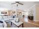 Inviting living room with tile flooring, open layout, and natural light creates a seamless flow into the dining and entry areas at 4010 Paw Paw Trl, Lake Wales, FL 33898