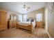 Bright bedroom with hardwood floors, natural light, and a ceiling fan at 4010 Paw Paw Trl, Lake Wales, FL 33898