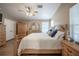 Bedroom with hardwood floors, large bed, and multiple windows with natural light at 4010 Paw Paw Trl, Lake Wales, FL 33898