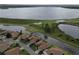Overhead shot of property and surrounding golf course and lake provides serene views at 4063 Birkdale Dr, Lake Wales, FL 33859