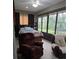 Bedroom with a recliner, bed, windows with view to the outside at 4063 Birkdale Dr, Lake Wales, FL 33859