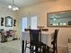 Dining area with table, chairs, and a large mirror reflecting the adjacent living space at 4063 Birkdale Dr, Lake Wales, FL 33859