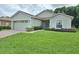 Charming single-story home featuring a brick driveway and a well-maintained front lawn at 4063 Birkdale Dr, Lake Wales, FL 33859