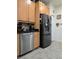 Modern kitchen featuring stainless steel appliances, wooden cabinets, and tile flooring at 4063 Birkdale Dr, Lake Wales, FL 33859