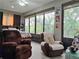 Sunroom with recliner seating, large windows with sun shades, and view to the outdoors at 4063 Birkdale Dr, Lake Wales, FL 33859