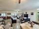 Open-concept living space featuring tile floors, comfortable seating, and a ceiling fan at 4063 Birkdale Dr, Lake Wales, FL 33859