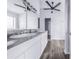 Bathroom features dual sinks, gray countertops and tiled flooring at 4099 Island Lakes Dr, Winter Haven, FL 33881